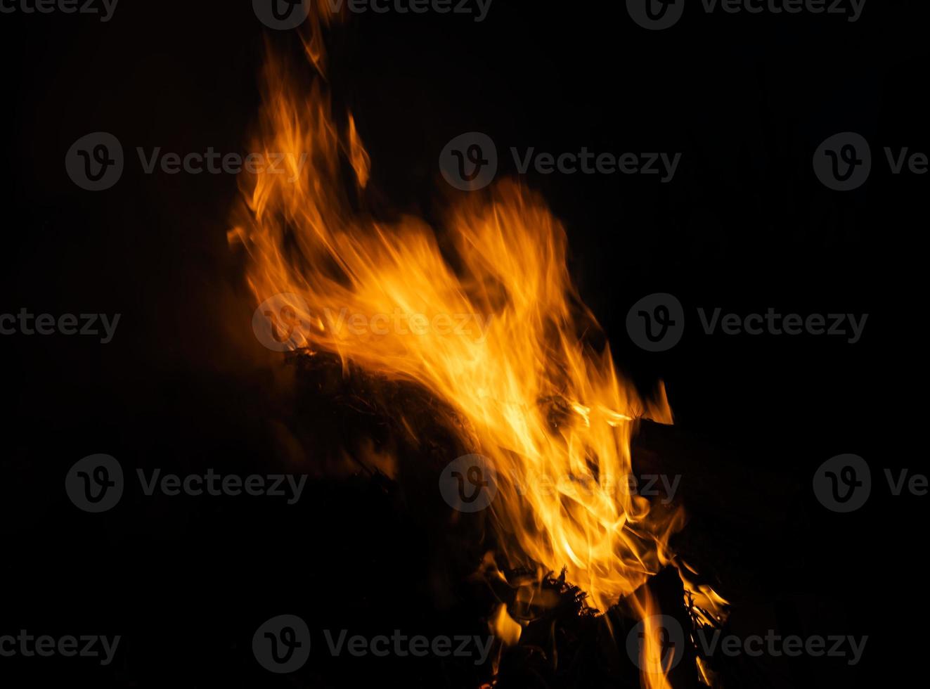 Fire flames on a black background photo