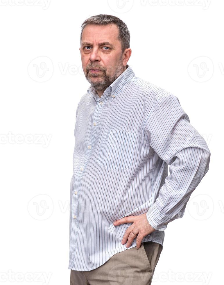 Handsome positive middle-aged business man standing and thinking photo