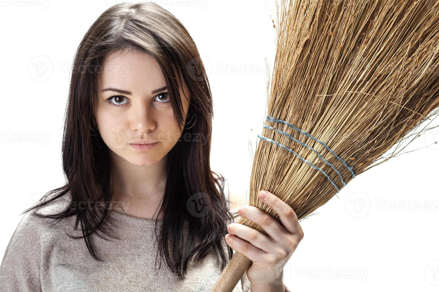 Young woman with a broom photo