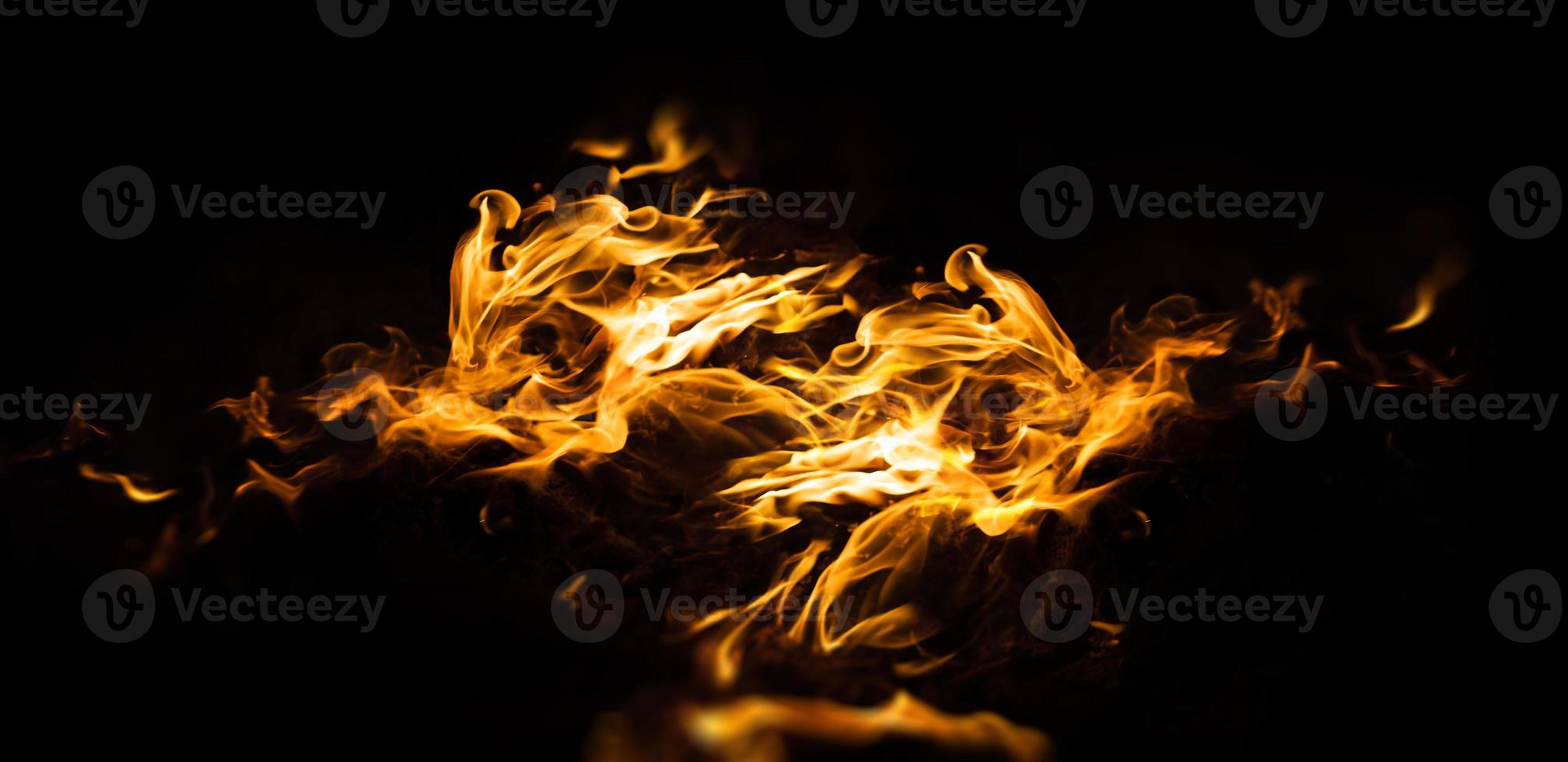 Fire flames on a black background photo