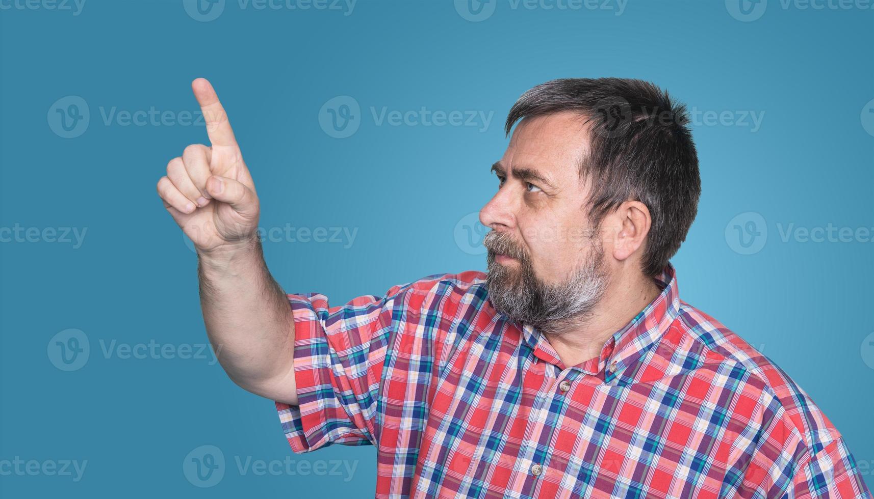 middle-aged man pointing with finger photo
