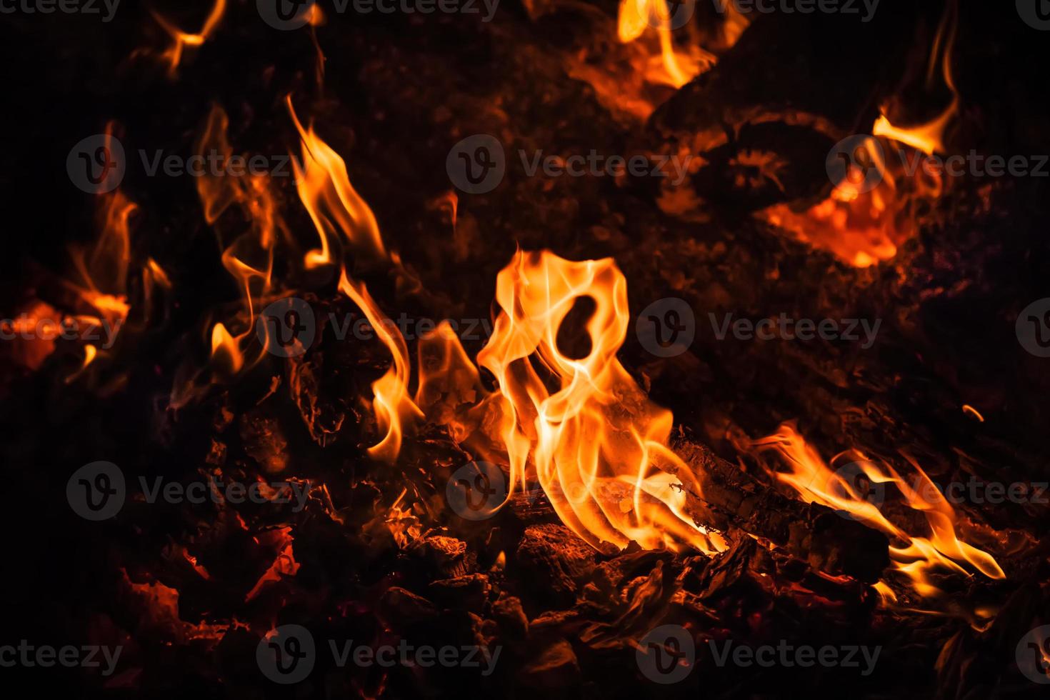 Flames of bonfire at night photo