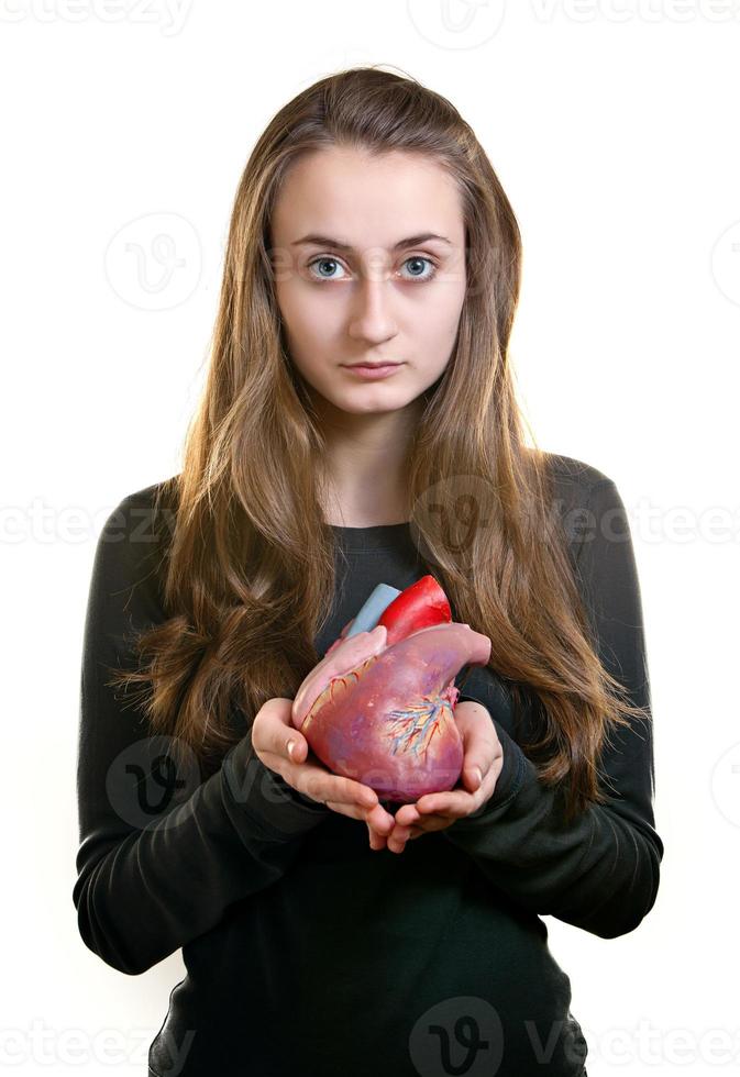 Young woman with a heart i photo