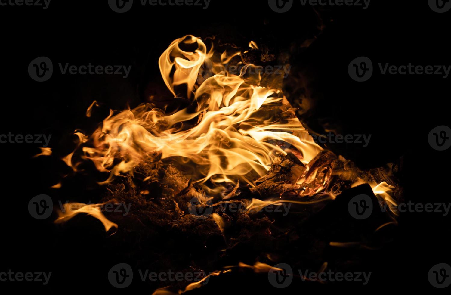 Fire flames on a black background photo