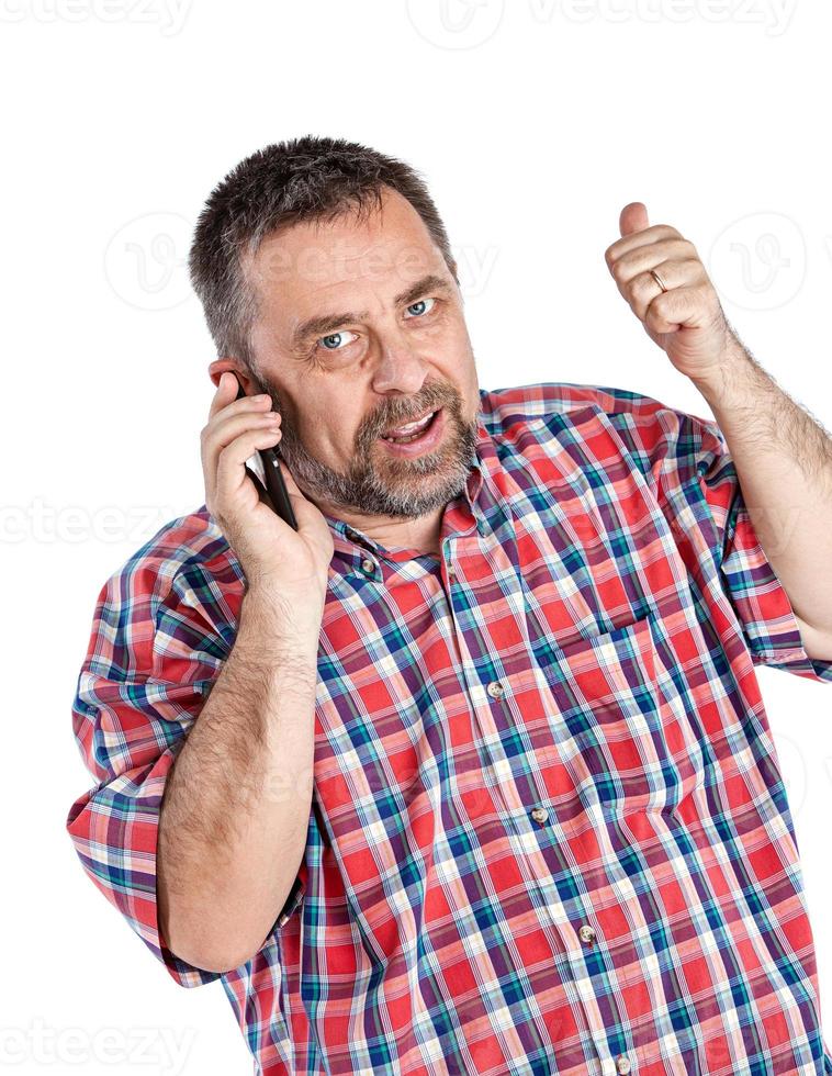 middle-aged man speaks on a mobile phone photo