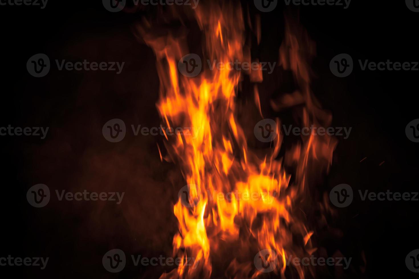 Fire flames on a black background photo