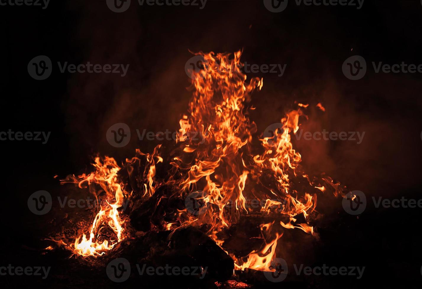 Flames of bonfire at night photo