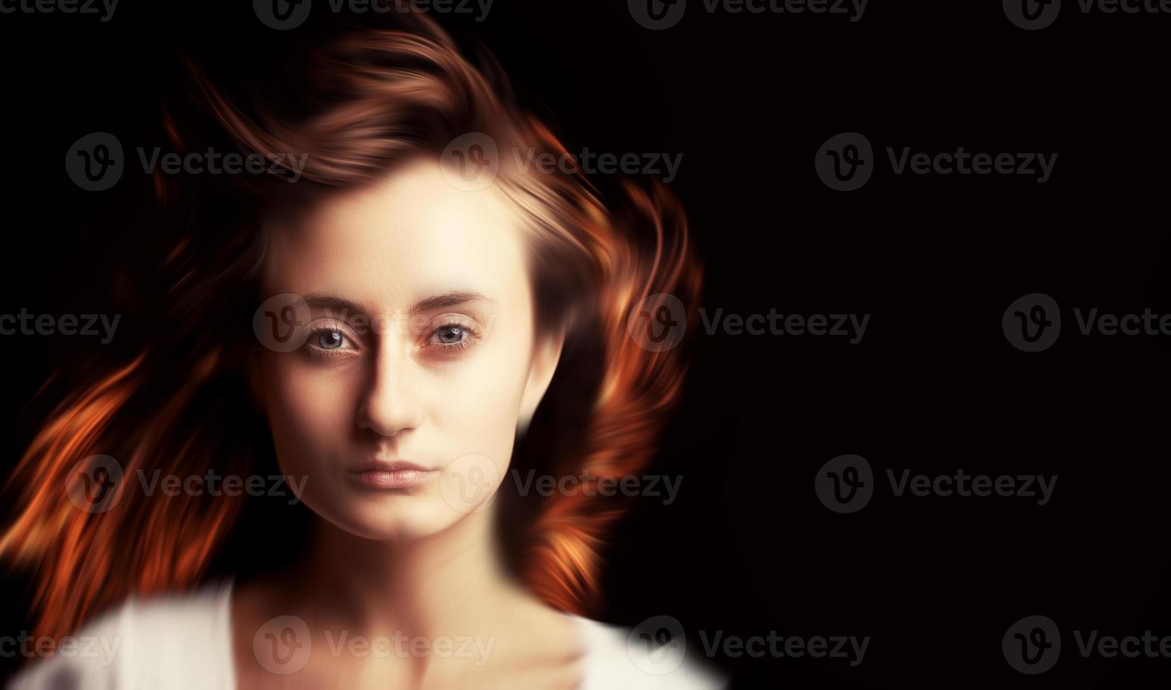 Portrait of a young woman with motion blur hair photo