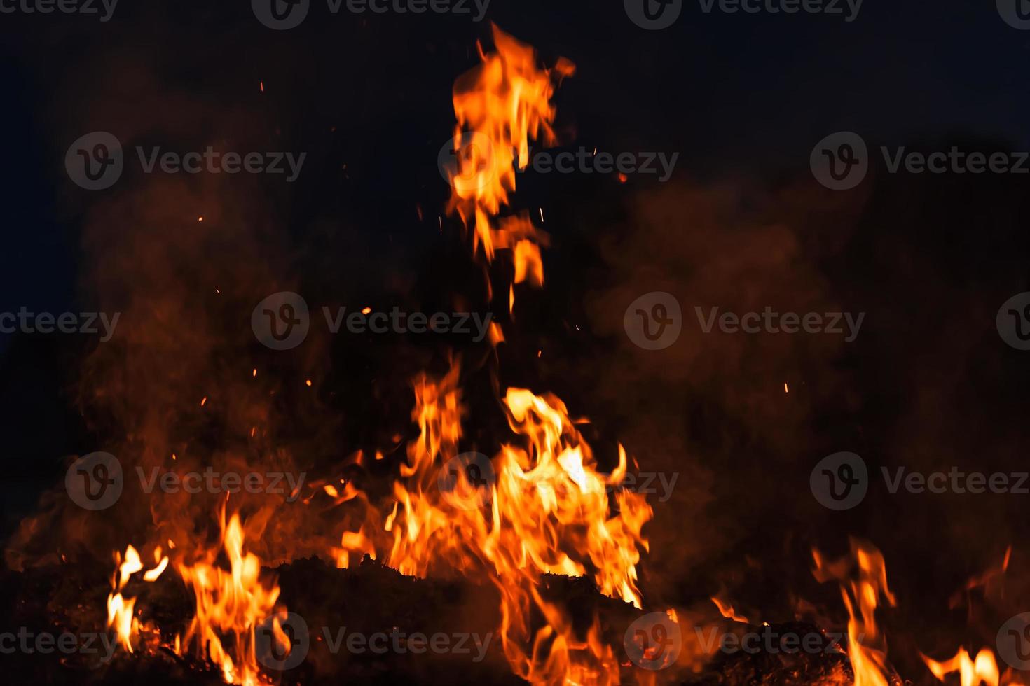 Flames of bonfire at night photo