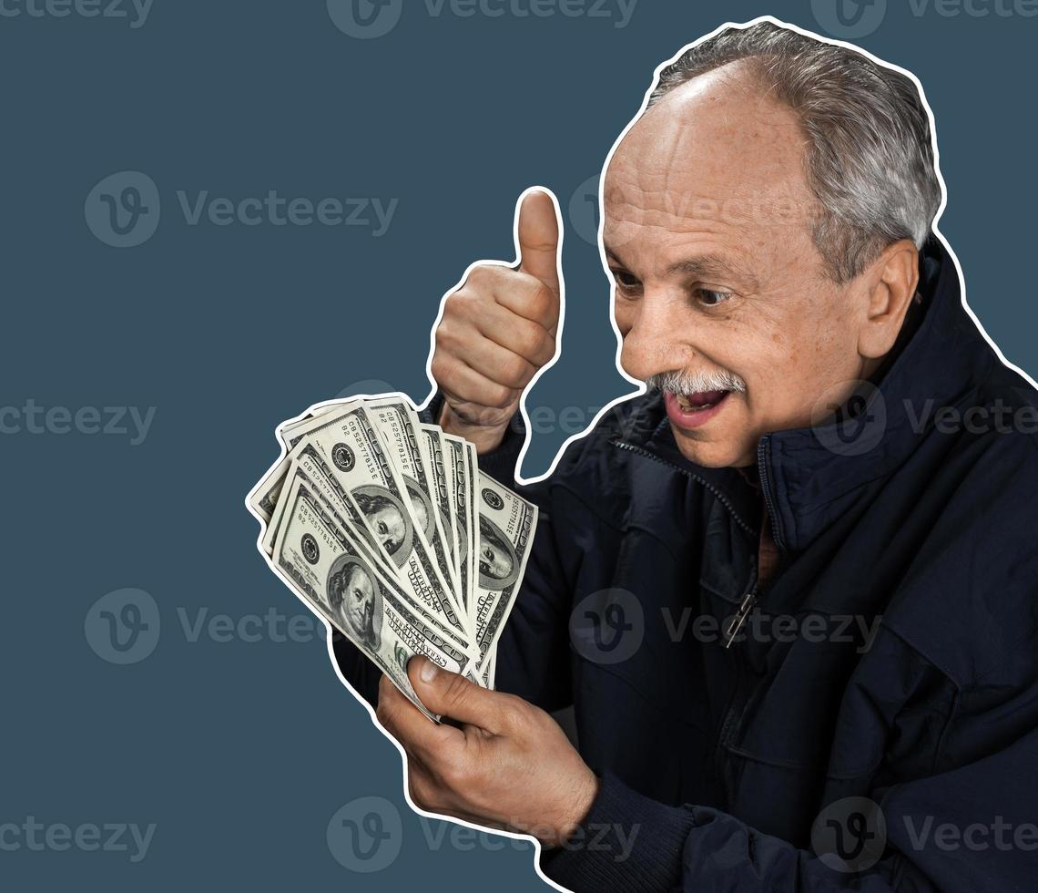 Senior gentleman holding a stack of money photo