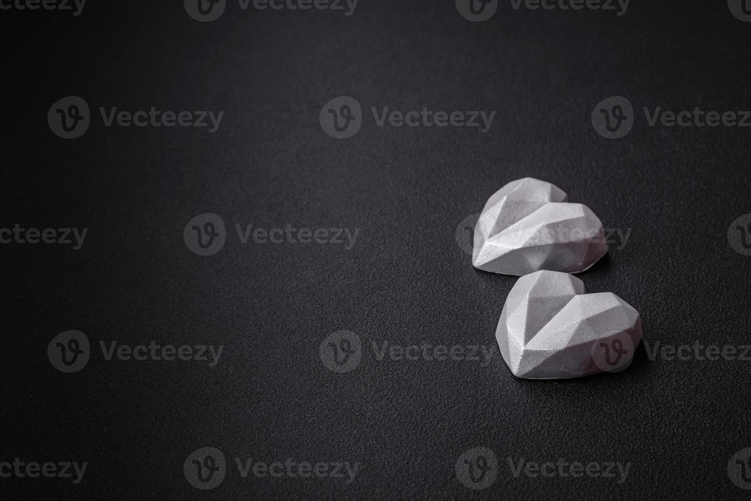Beautiful tasty sweet candies in gray color on a dark concrete background photo
