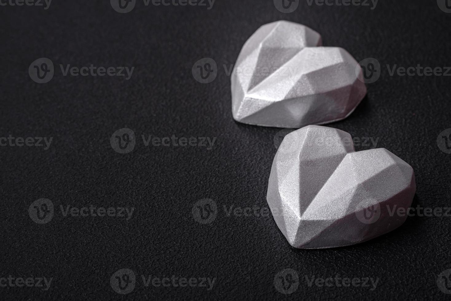 Beautiful tasty sweet candies in gray color on a dark concrete background photo