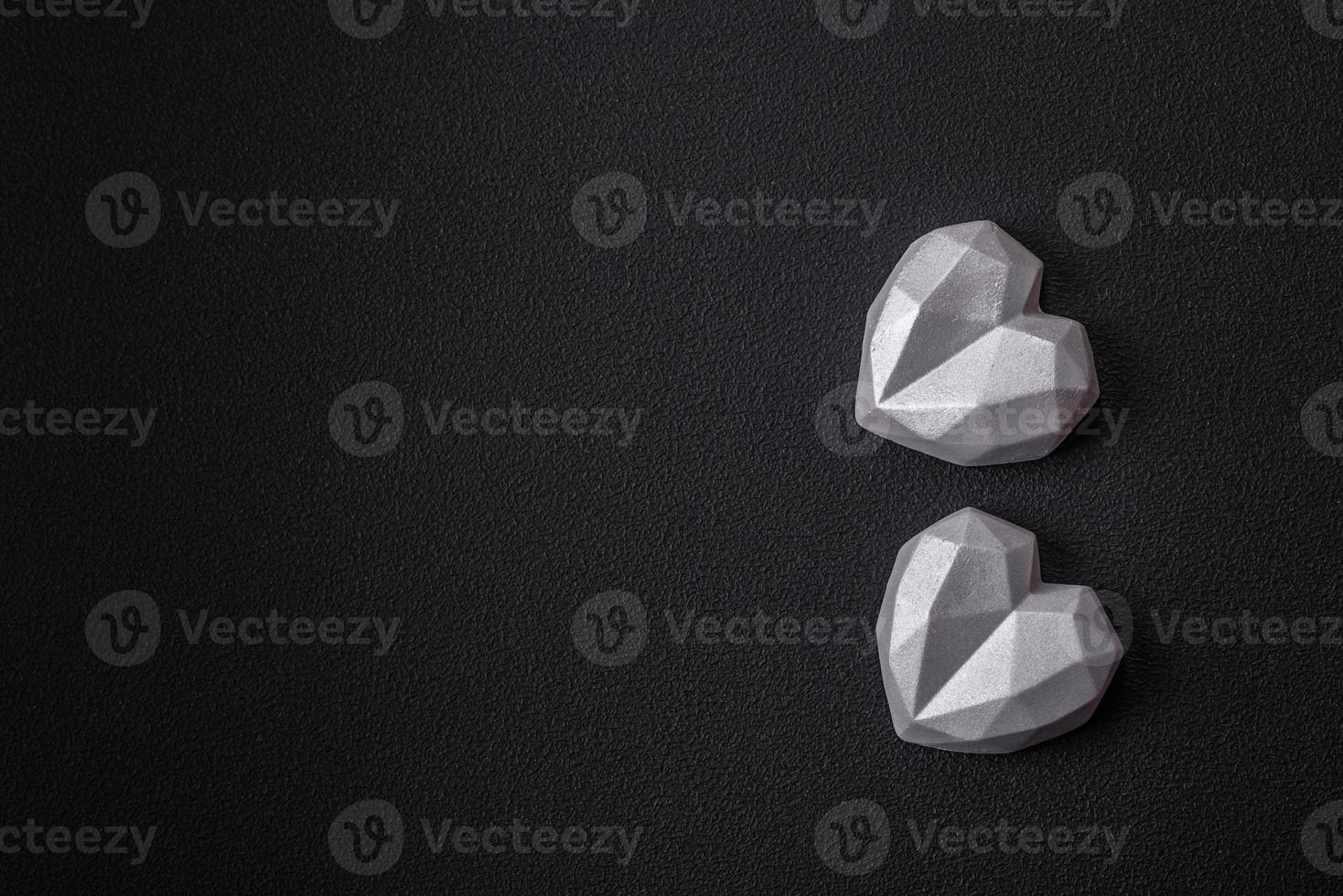 Beautiful tasty sweet candies in gray color on a dark concrete background photo