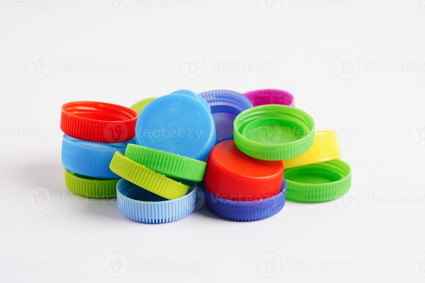 Plastic bottle caps colorful for recycle on white background. photo