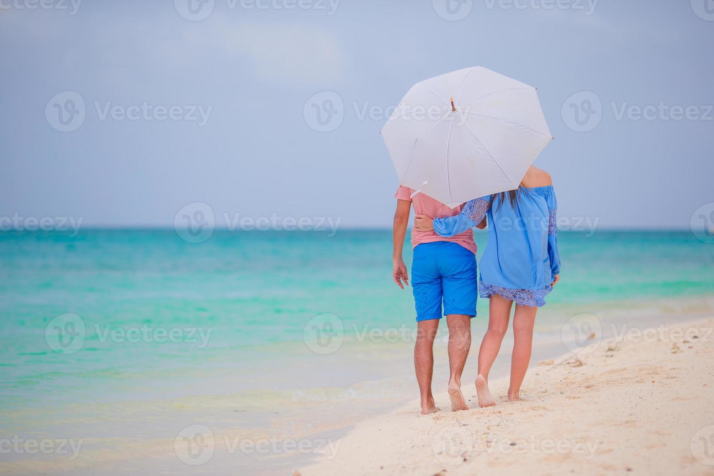 Young happy couple during beach tropical vacation photo