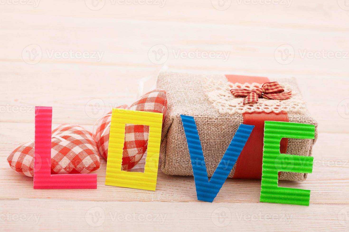 Word love on blue wooden background. Top view photo