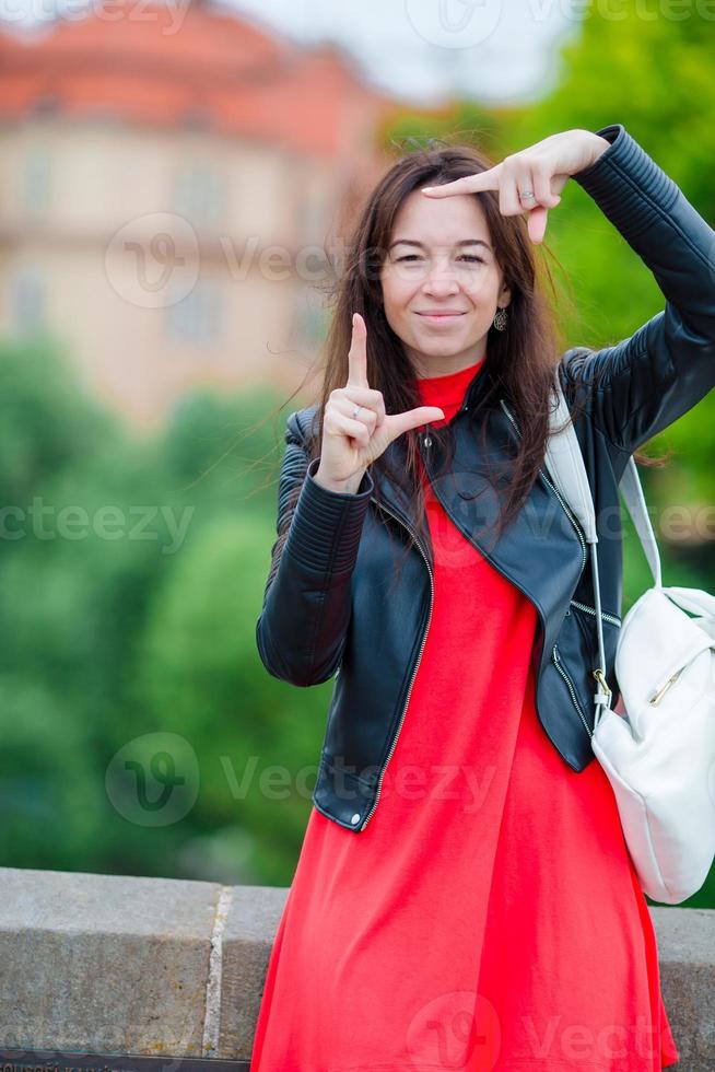 Happy young urban woman in european city. Caucasian tourist walking along the deserted streets of Europe. photo