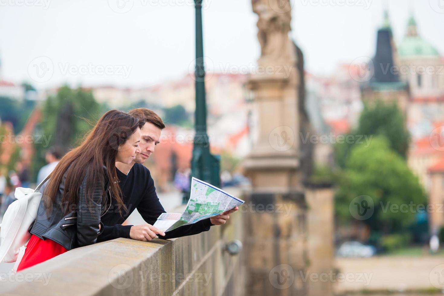 Romantic couple walking together in Europe. Happy lovers enjoying cityscape with famous landmarks. photo