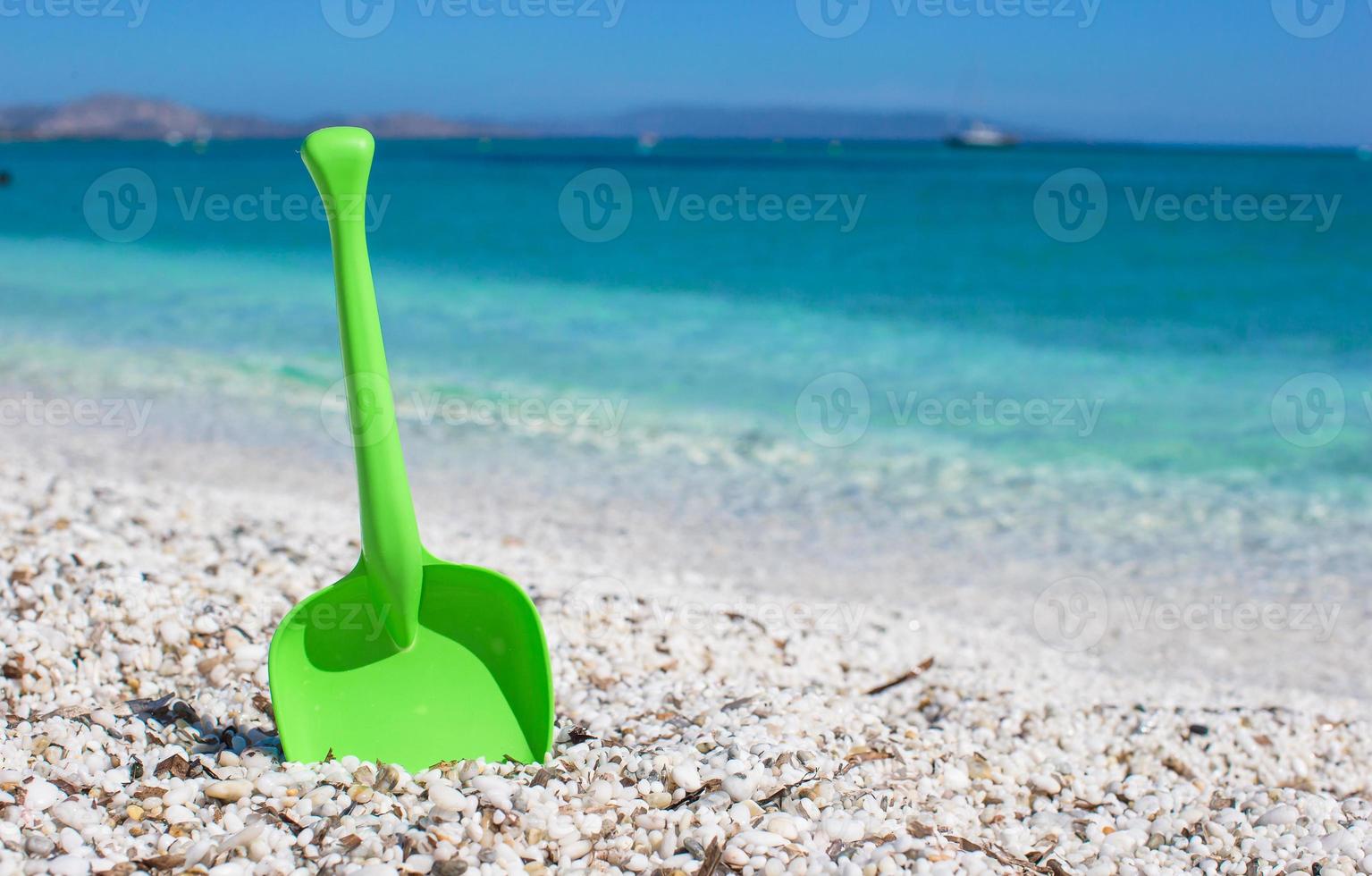 Summer kid's beach toy in the white sand photo