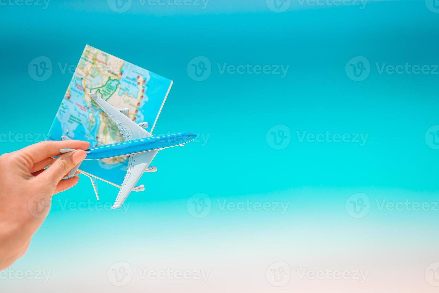 Closeup of map and model airplane background the sea photo
