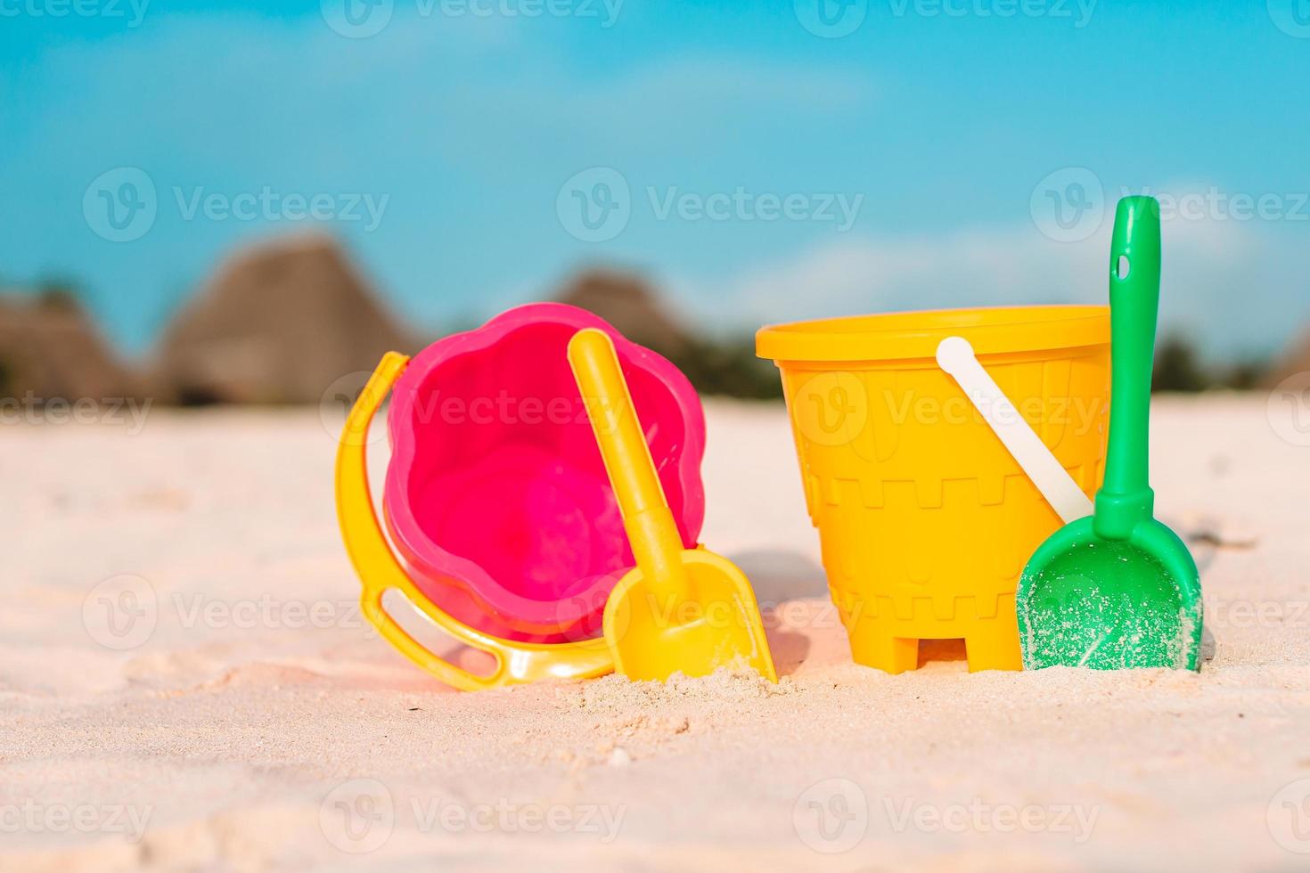 Beach kid's toys on white sand beach photo