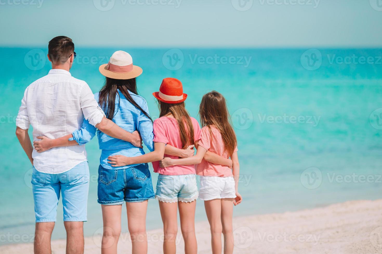 Photo of happy family having fun on the beach. Summer Lifestyle