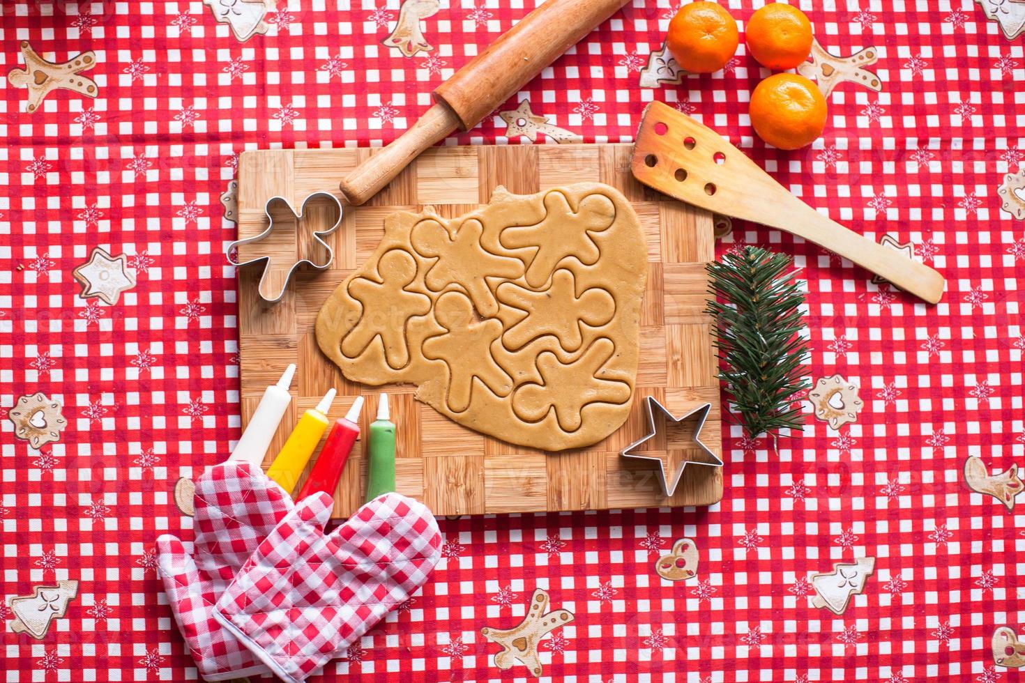 Making gingerbread man and christmas cookies photo