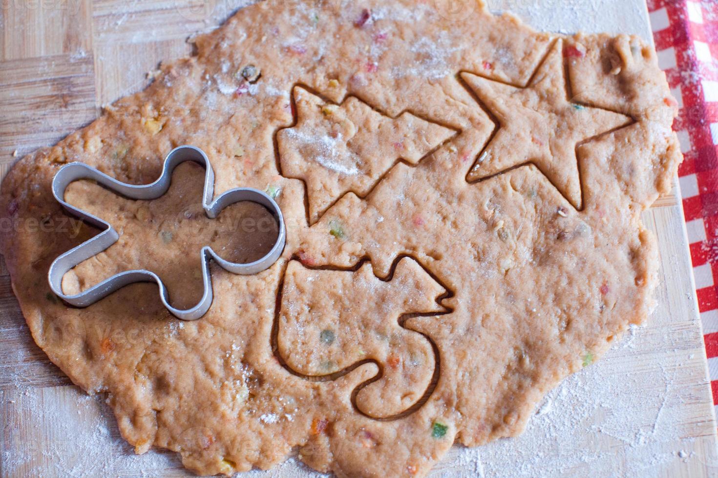 Making gingerbread man and christmas cookies photo