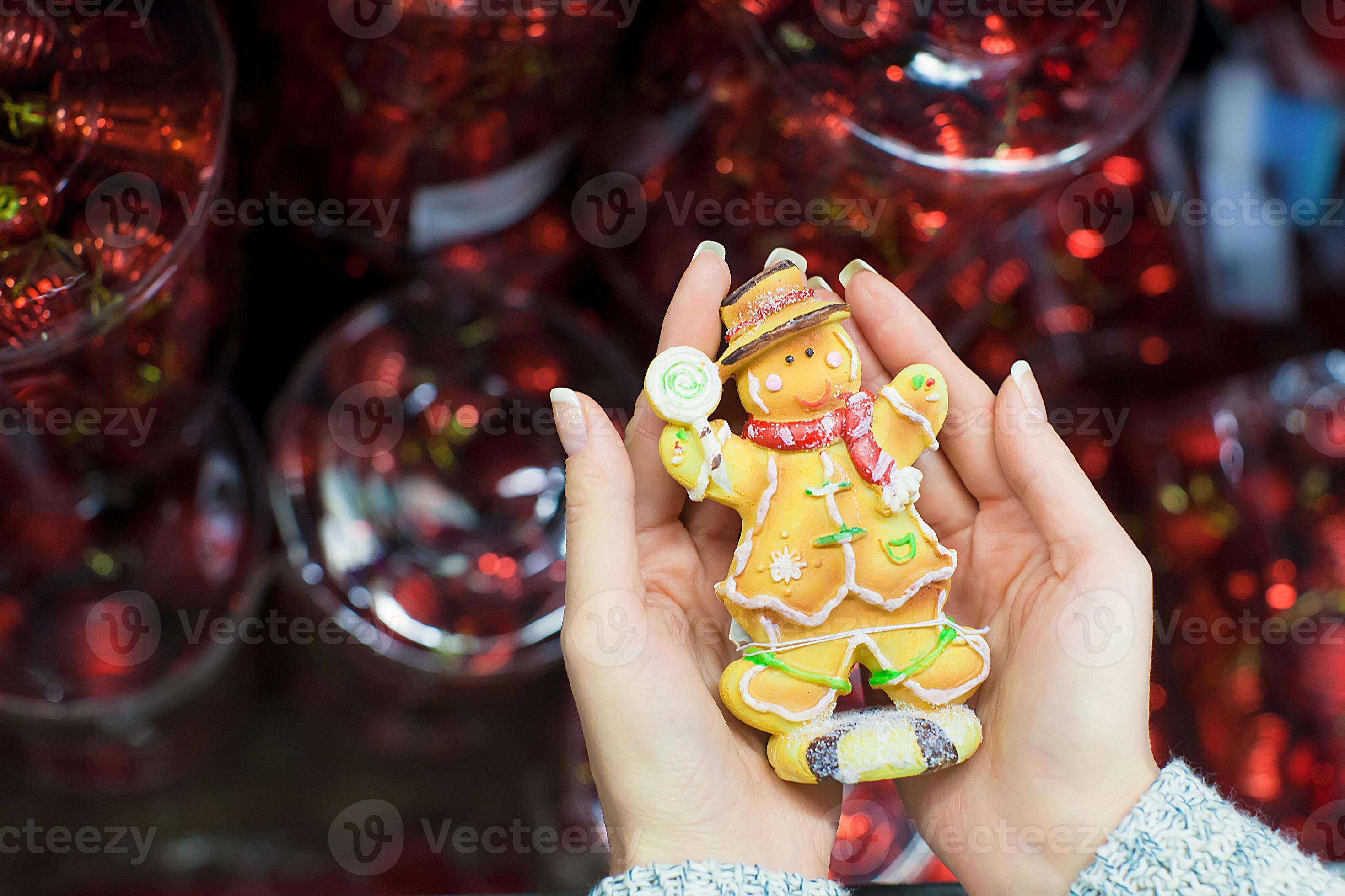 Colorful gingerbread man in female hands 18241983 Stock Photo at Vecteezy