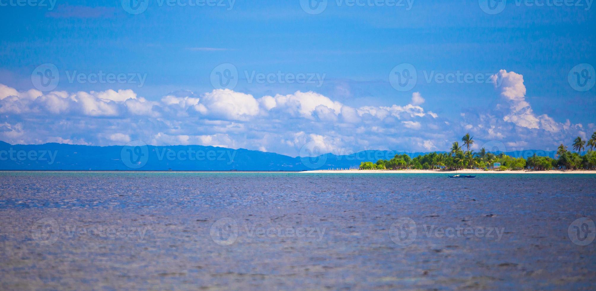 Uninhabited tropical island in the open ocean in the Philippines photo