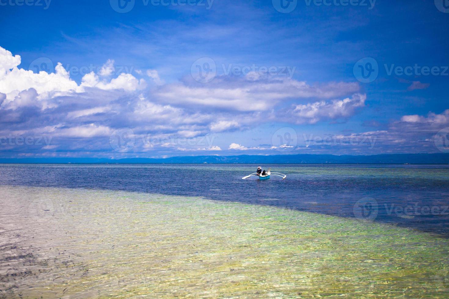 Beautiful white tropical beach on desert island photo