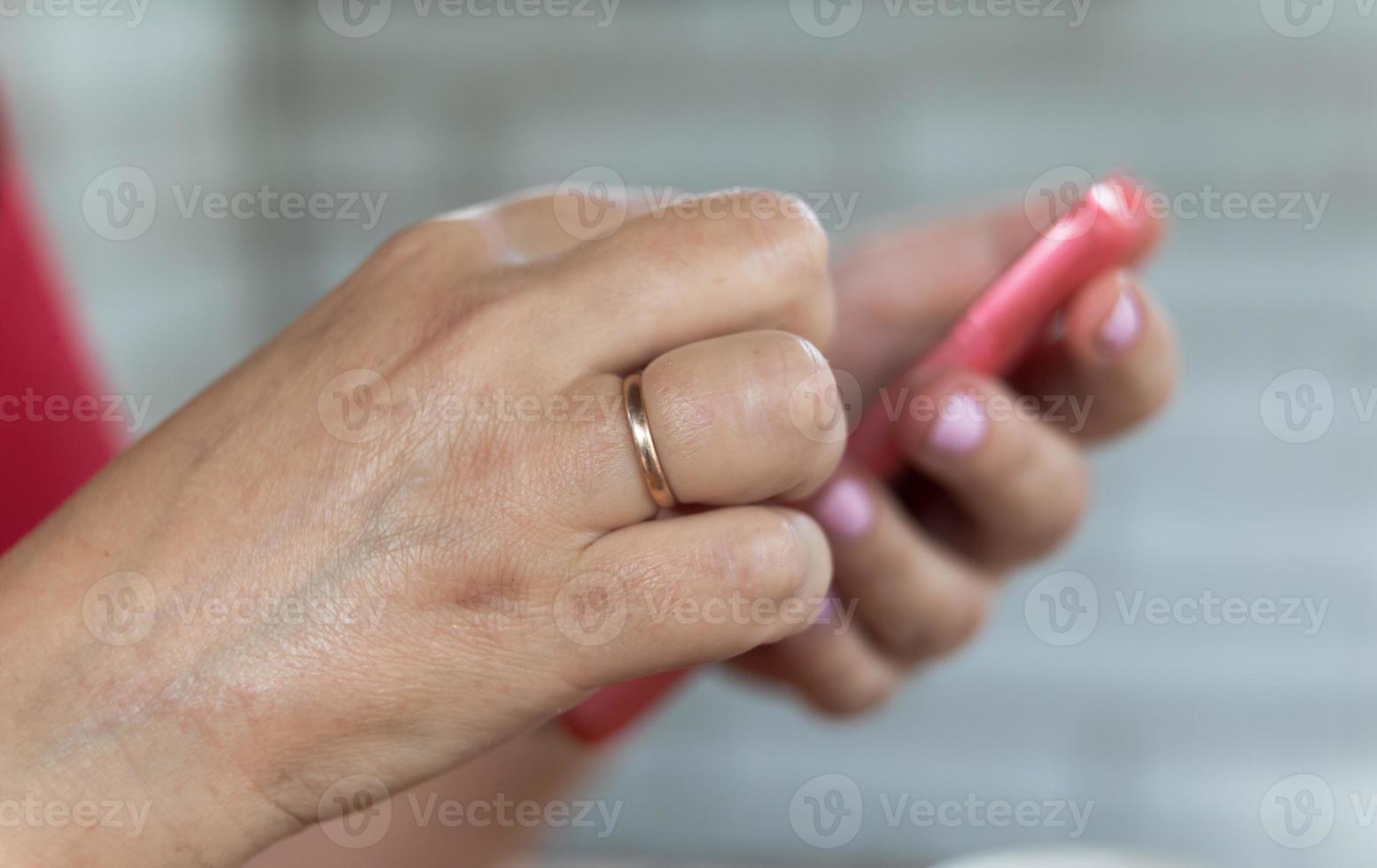 Mobile phone in a woman's hand photo