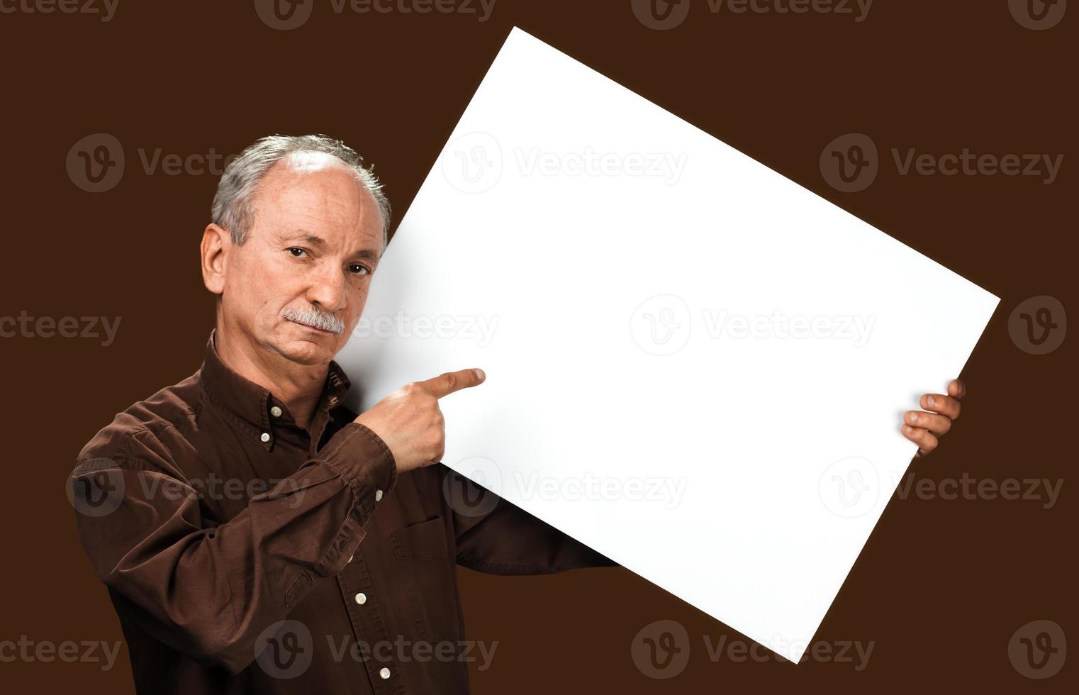 Senior man holds a blank board photo