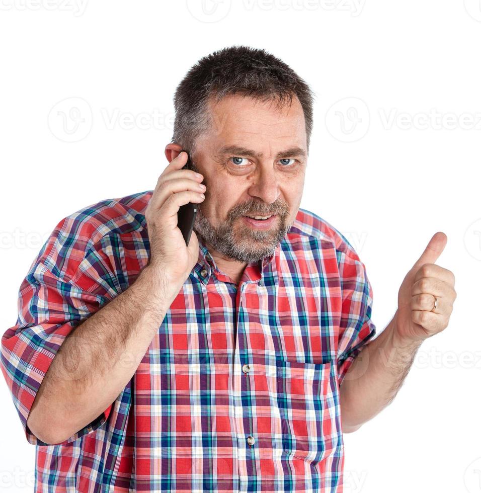 middle-aged man speaks on a mobile phone photo