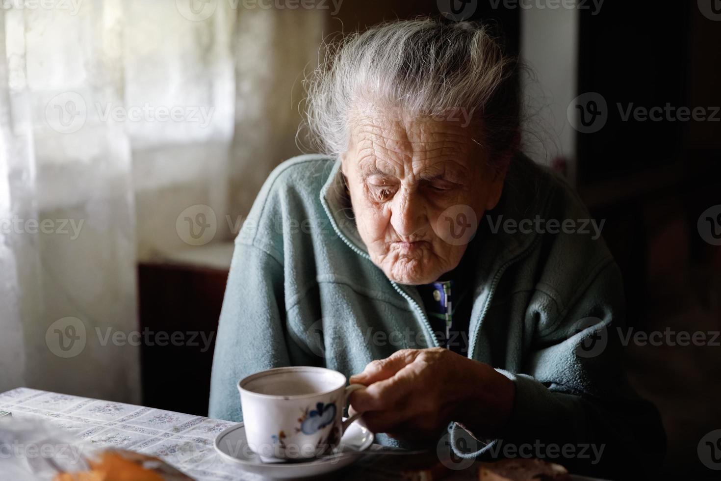 Elderly lonely woman photo