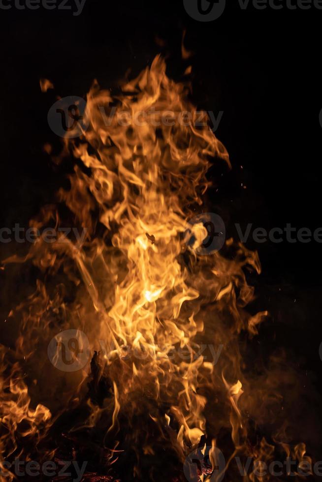 Fire flames on a black background photo
