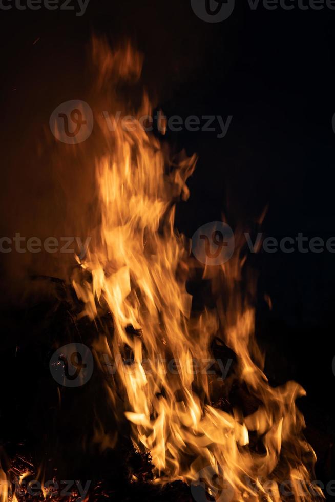 Fire flames on a black background photo