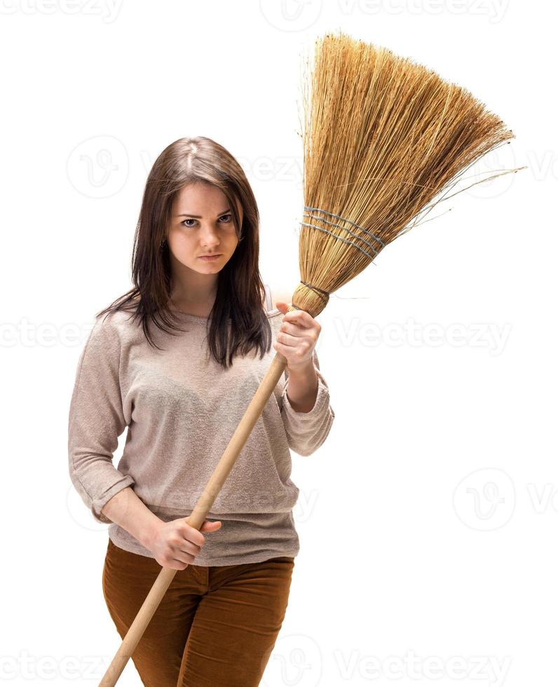 Young woman with a broom photo