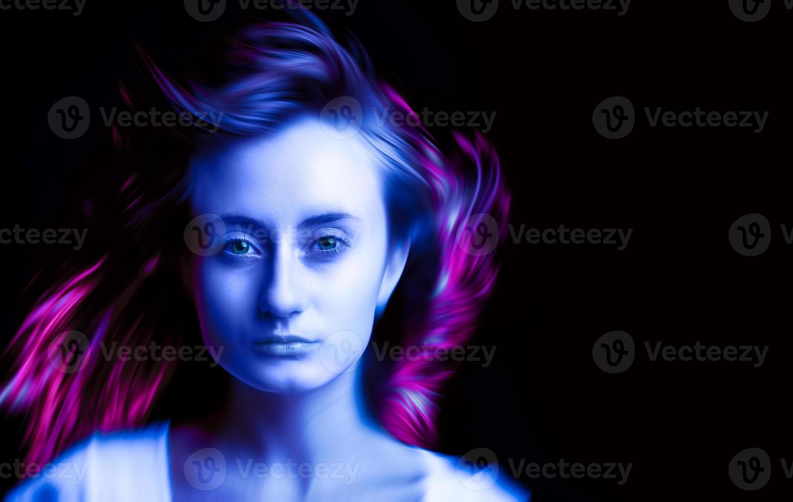 Woman in colorful bright neon blue and purple lights photo