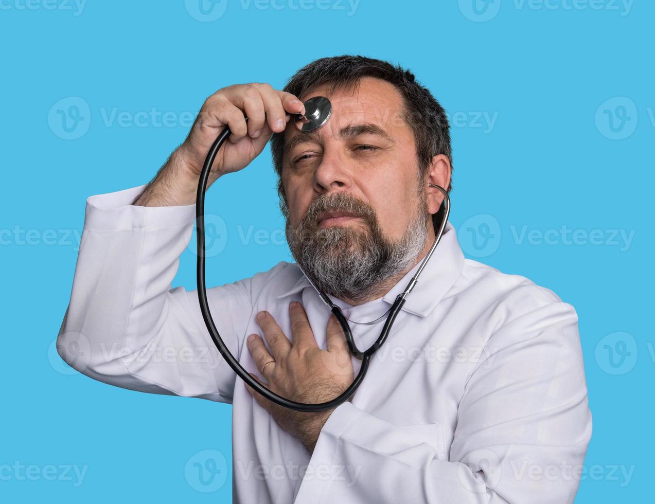 Mad doctor with a stethoscope photo