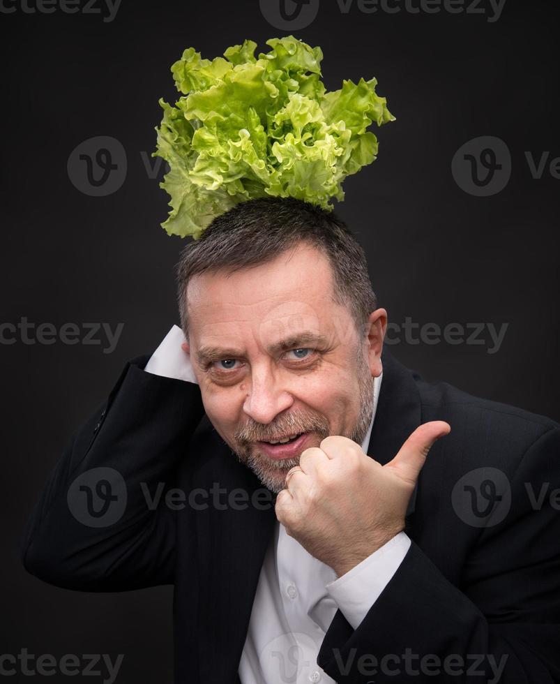 Healthy food.  Man holding lettuce photo