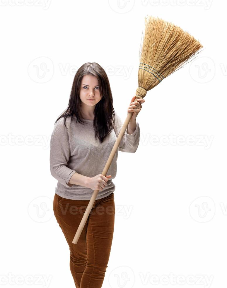 Young woman with a broom photo