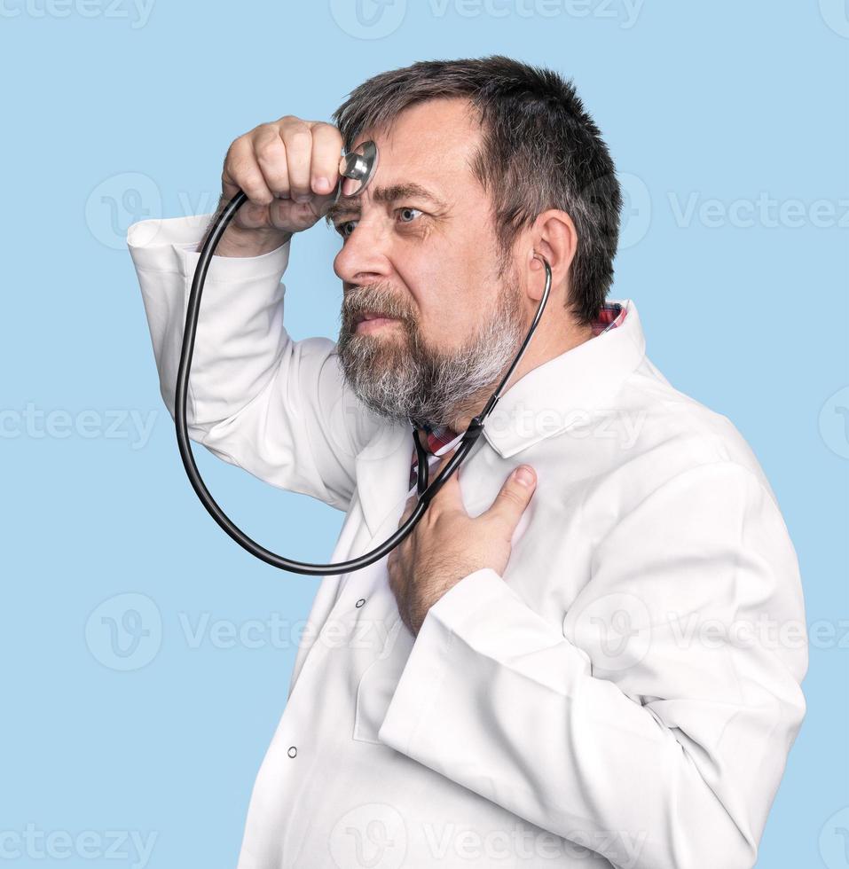 Mad doctor with a stethoscope 18716005 Stock Photo at Vecteezy