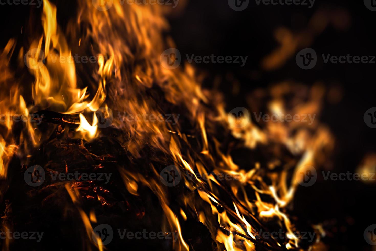 Fire flames on a black background photo