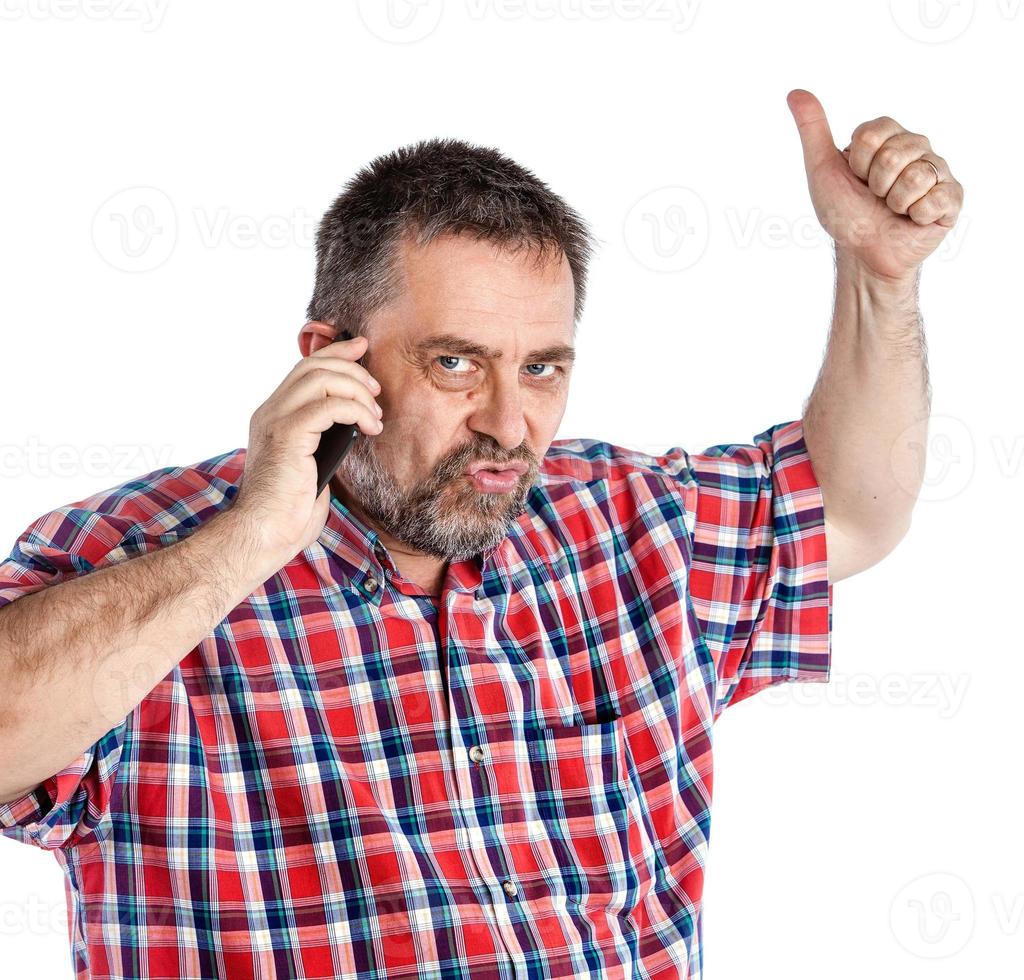 middle-aged man speaks on a mobile phone photo