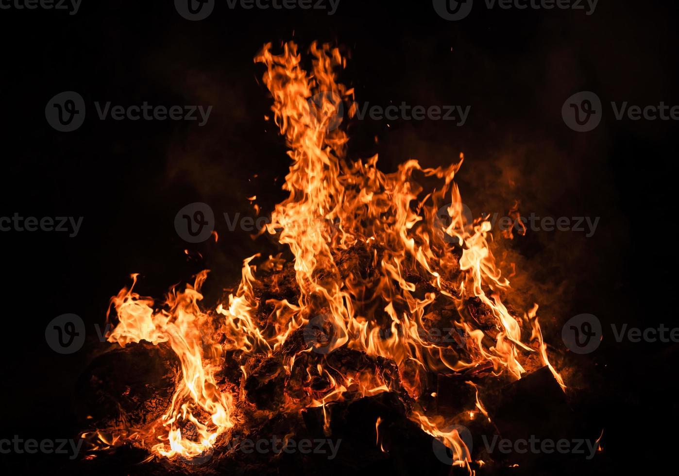 Flames of bonfire at night photo