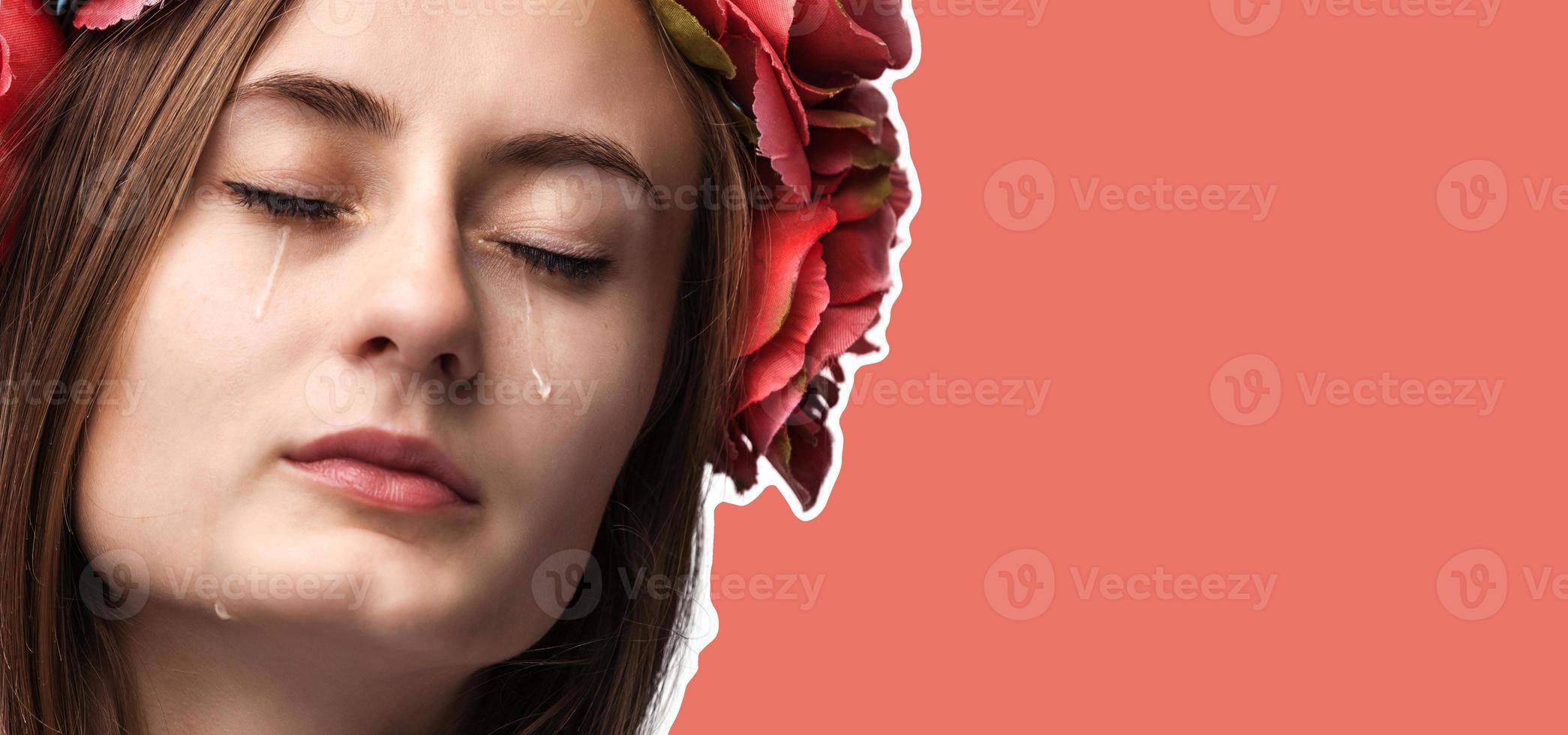 Portrait of young beautiful woman crying photo