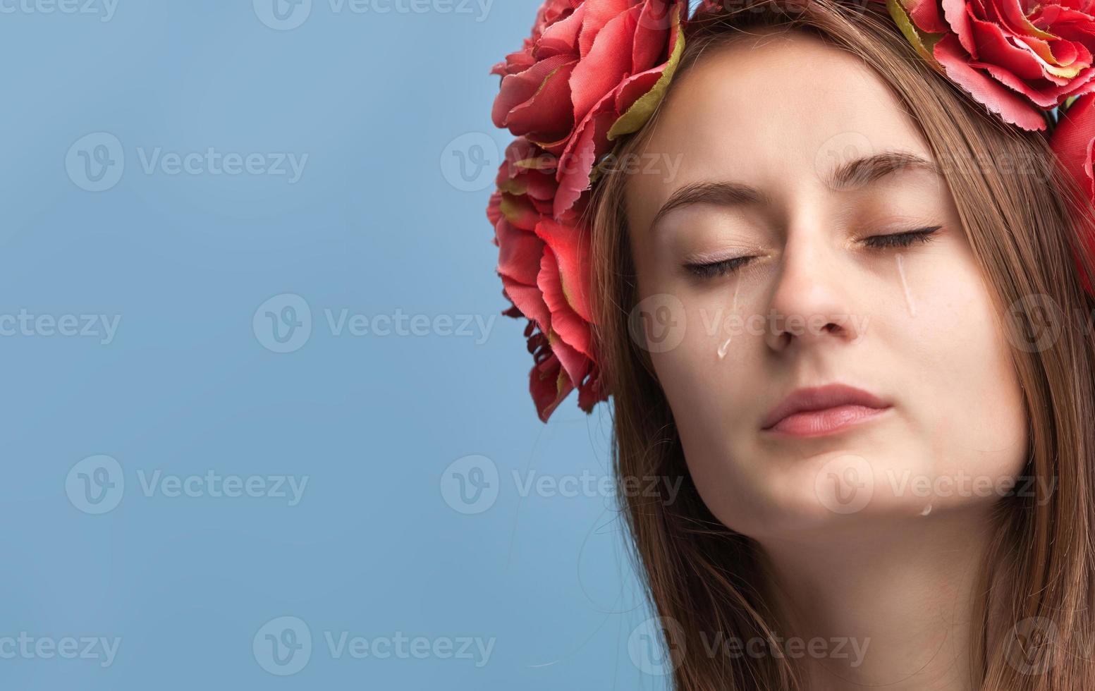 Portrait of young beautiful woman crying photo