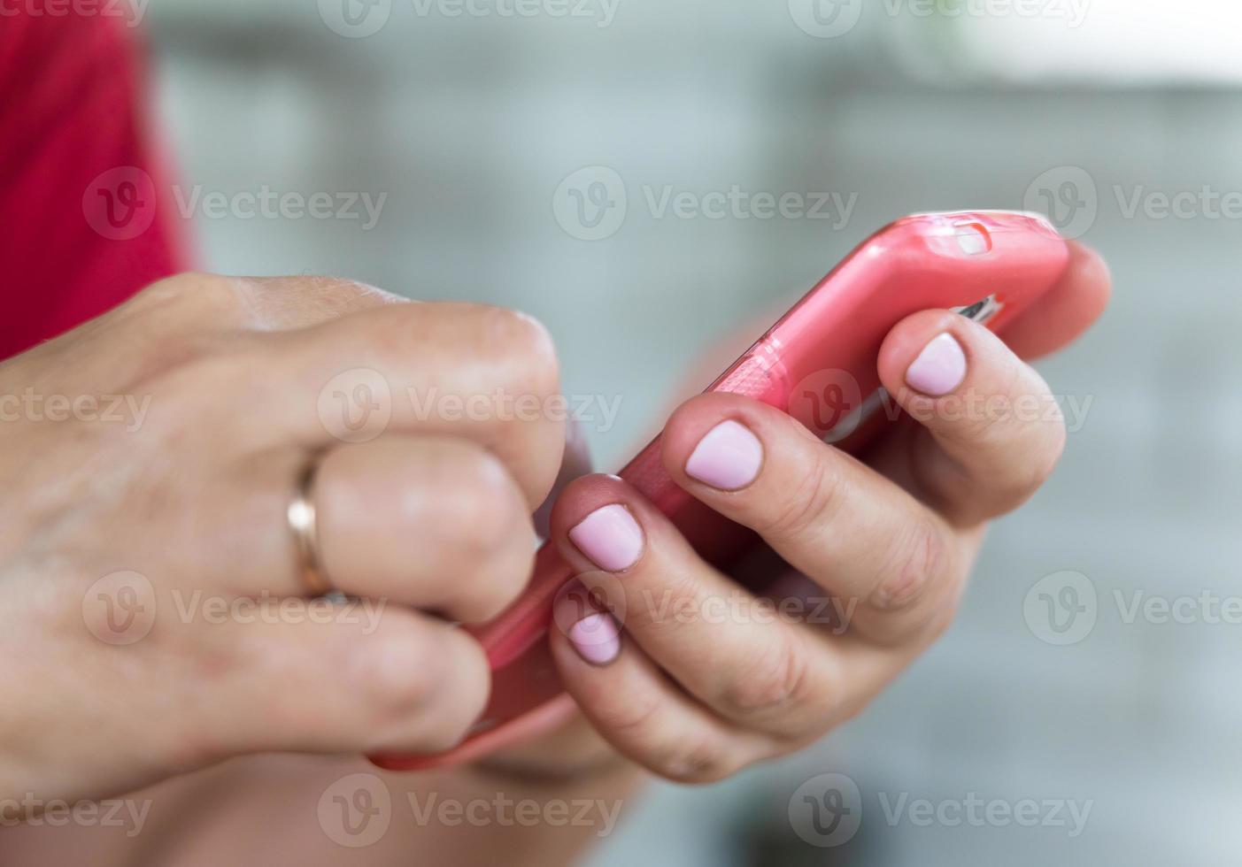 Mobile phone in a woman's hand photo