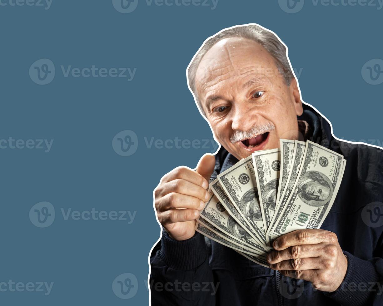 Senior gentleman holding a stack of money photo